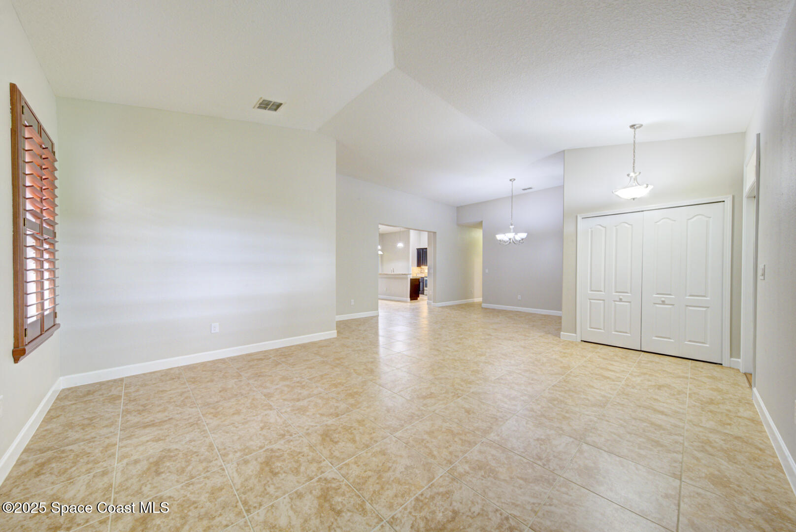 3352 Russ Place Melbourne, FL 32940 - Photo 6 of 67 a view of a big room with wooden cabinet and windows