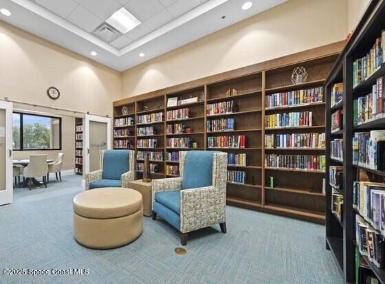 3352 Russ Place Melbourne, FL 32940 - Photo 63 of 67 a living room with furniture and a book shelf