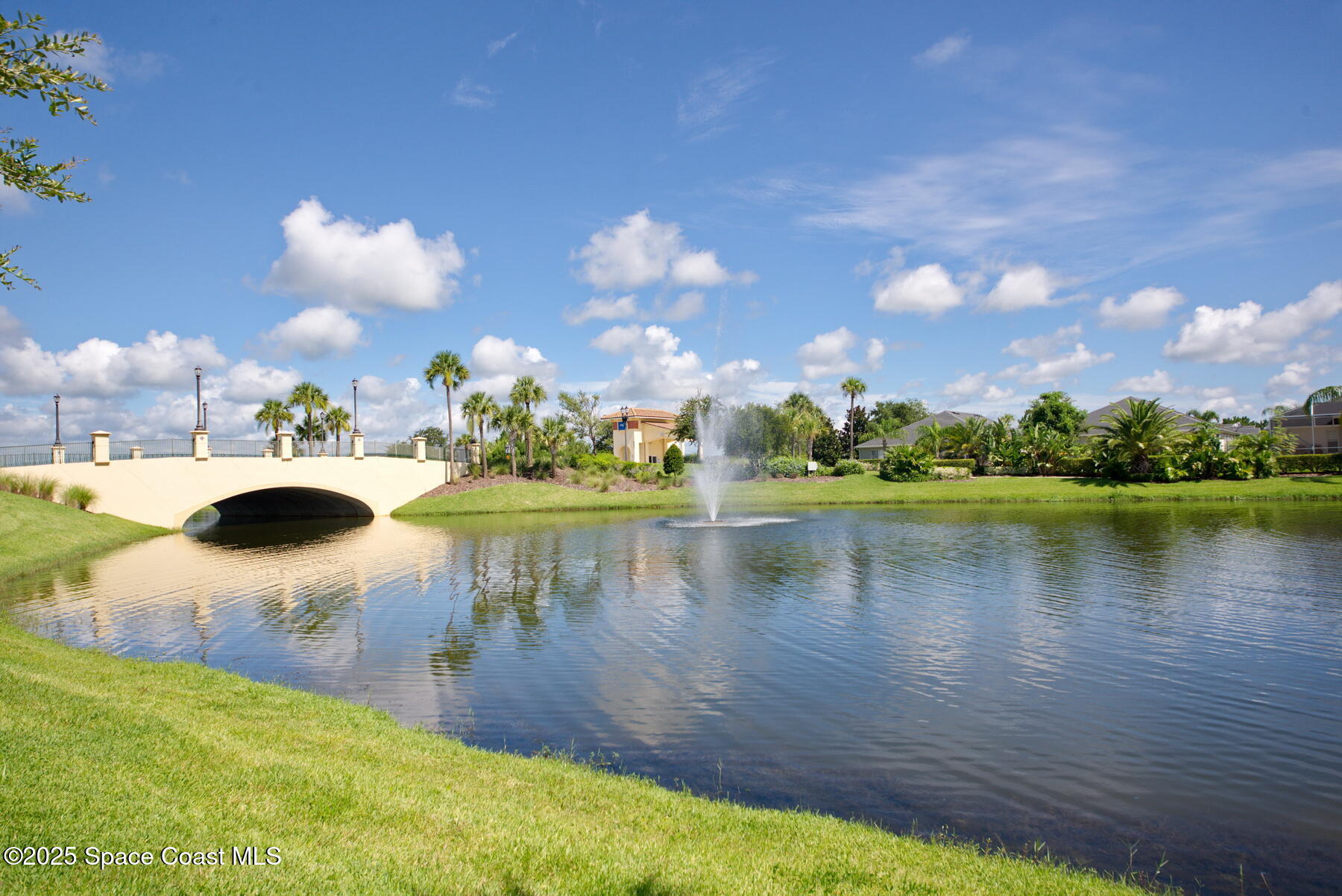 3352 Russ Place Melbourne, FL 32940 - Photo 66 of 67 a view of a lake in front of house with yard and outdoor seating
