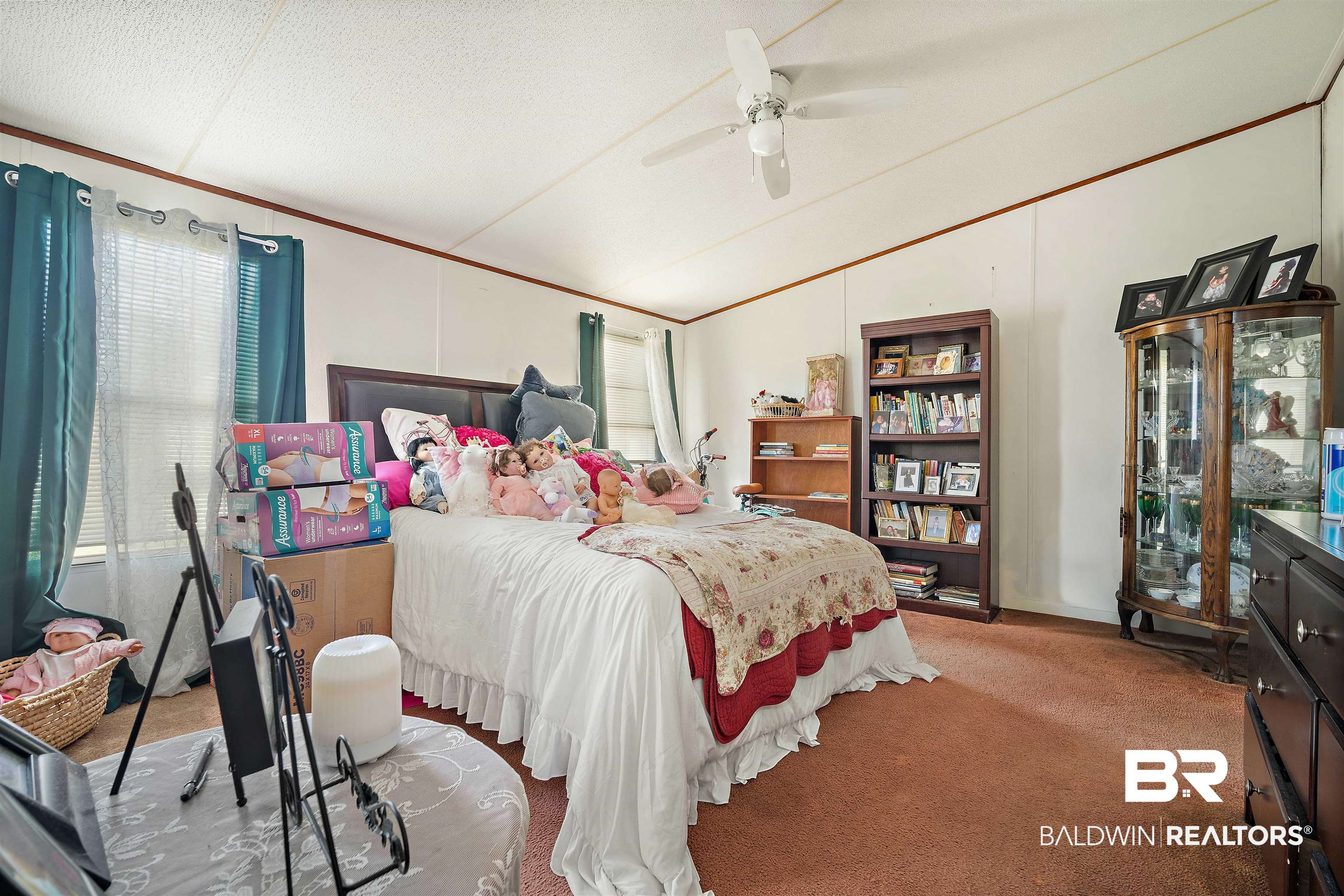 23700 Cumberland Road Robertsdale, AL 36567 - Photo 16 of 33 Bedroom with carpet floors, multiple windows, vaulted ceiling, ceiling fan, and ornamental molding