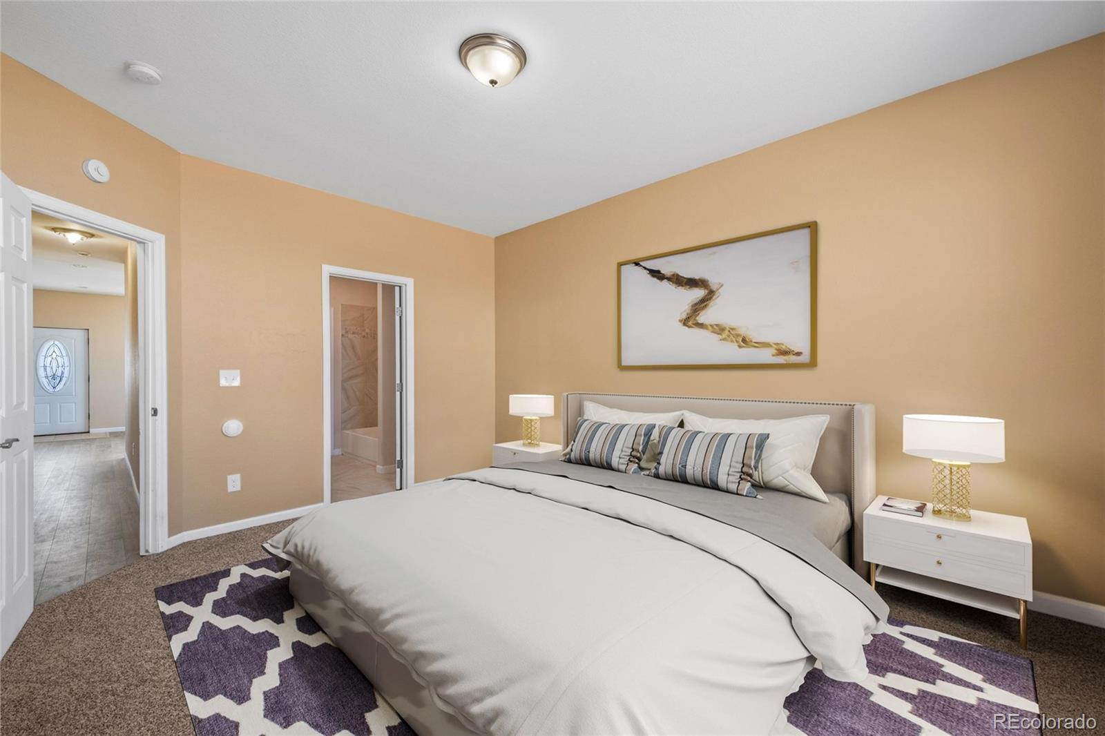 1445 4th Place Deer Trail, CO 80105 - Photo 12 of 19 a bedroom with a bed and a painting on the wall