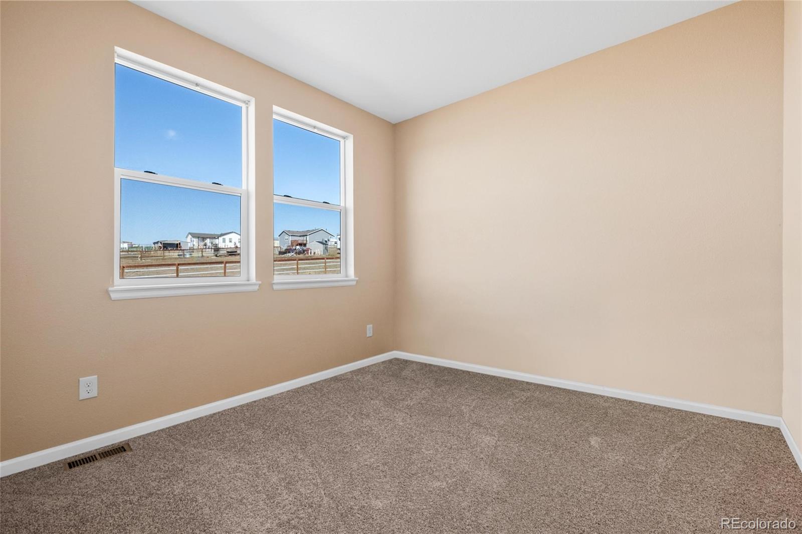 1445 4th Place Deer Trail, CO 80105 - Photo 9 of 19 an empty room with windows