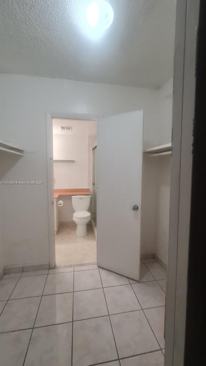 3640 Northwest 9th Street, Unit 105 Miami, FL 33125 - Photo 16 of 31 a bathroom with a toilet
