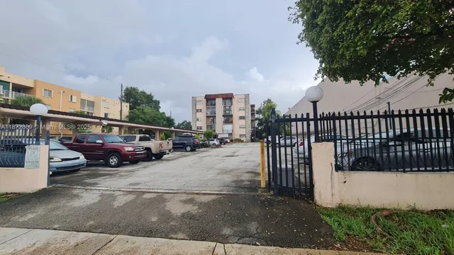 a view of street with parked cars