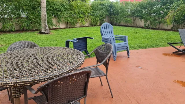 a living room with furniture stove and a window