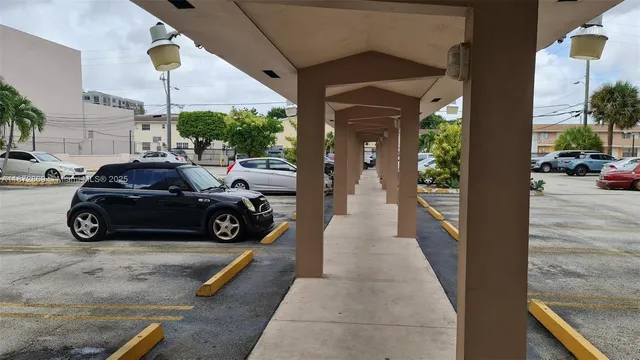 a view of a car parked in front of a house