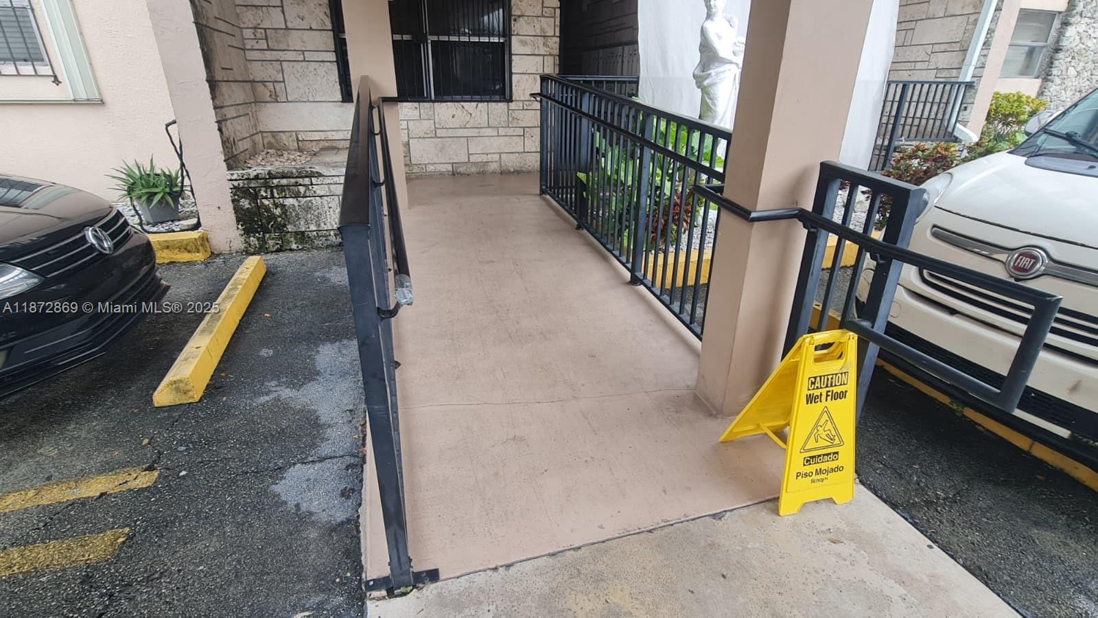 3640 Northwest 9th Street, Unit 105 Miami, FL 33125 - Photo 7 of 31 a view of a swimming pool with a lounge chairs