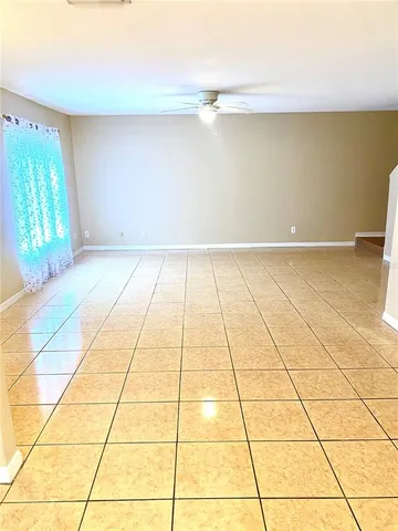 a view of an empty room and window