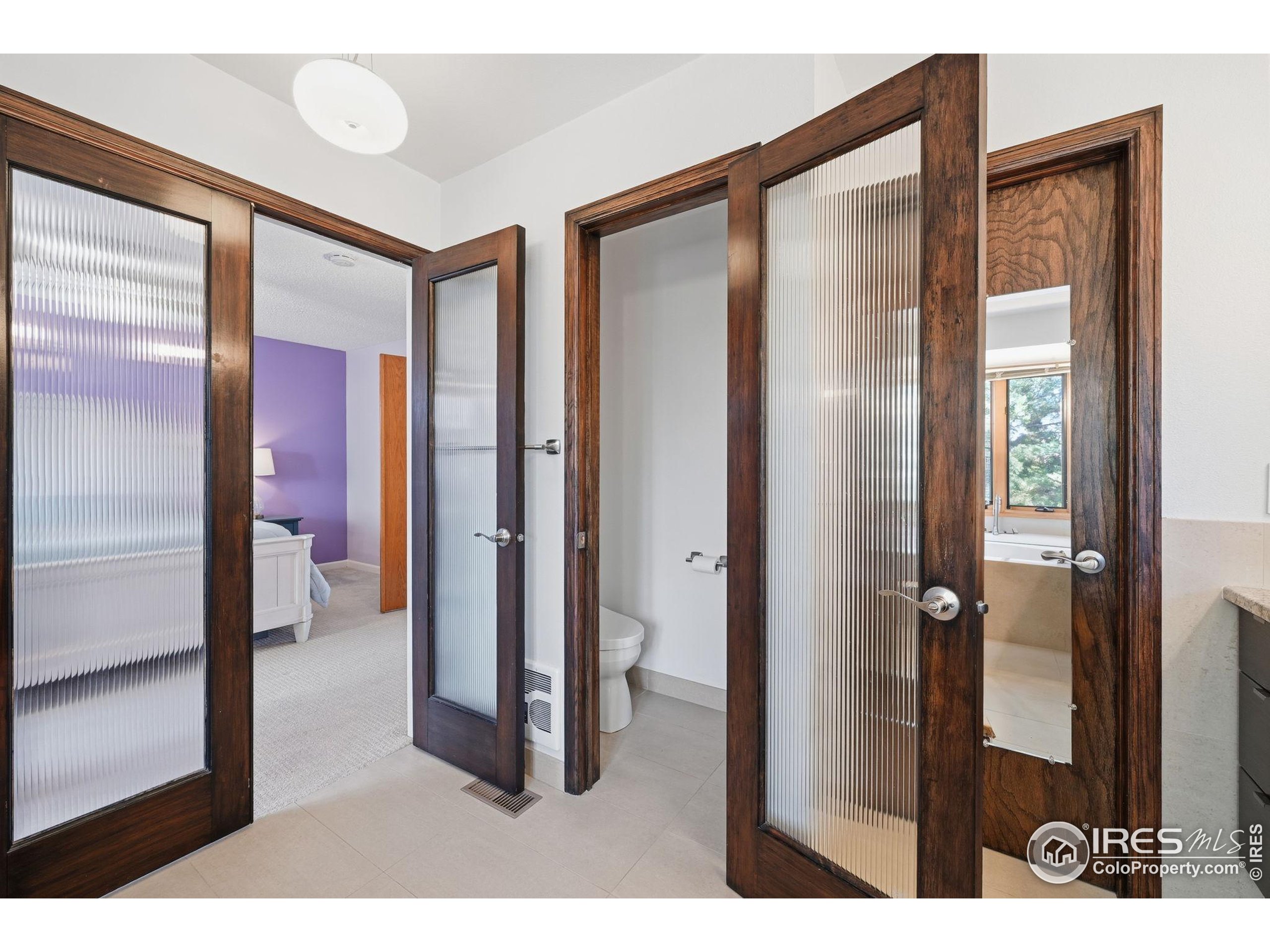 2158 Rockspray Court Longmont, CO 80503 - Photo 29 of 35 a bathroom with a glass shower door