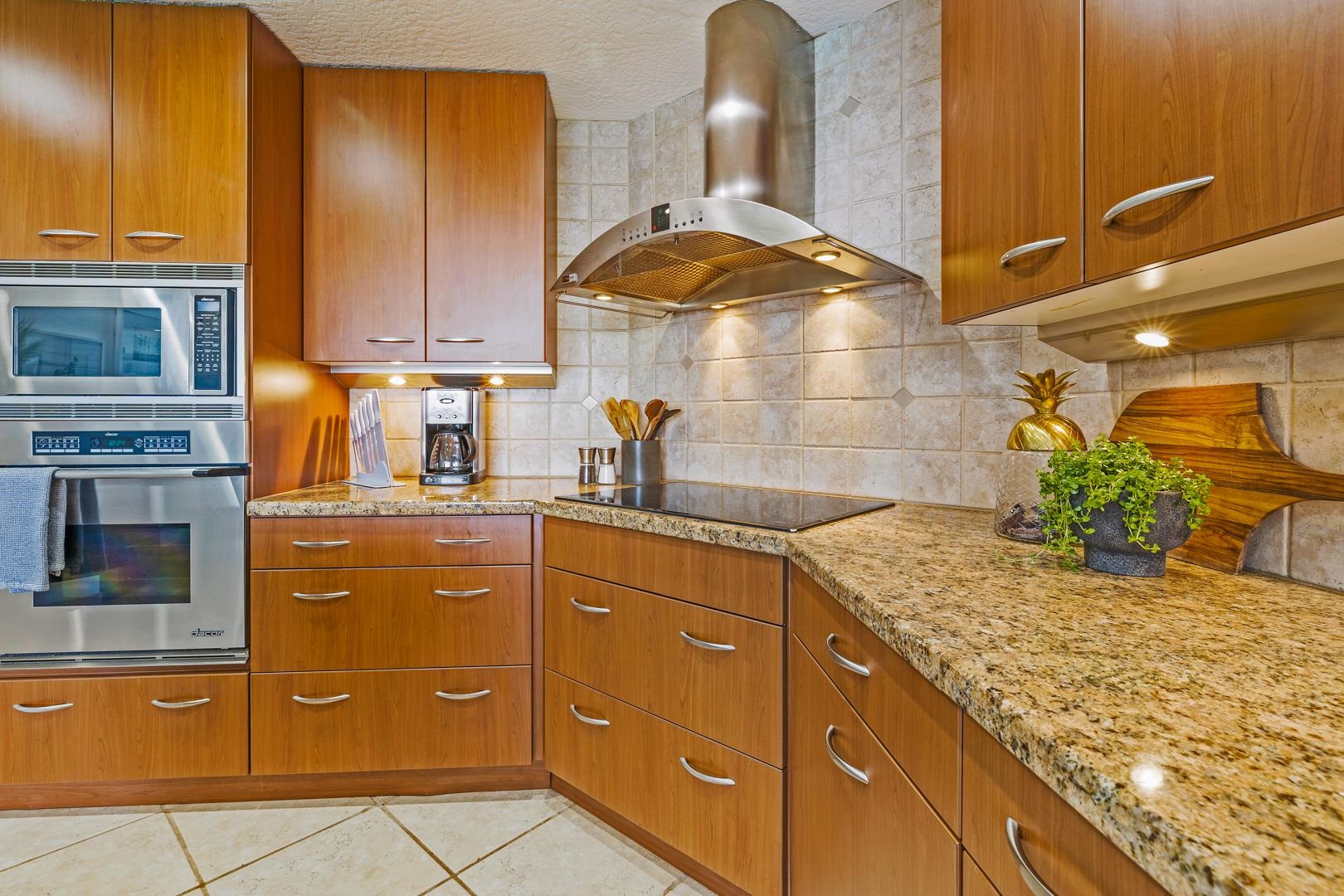 3875 Lower Honoapiilani Road, Unit B305 Lahaina, HI 96761 - Photo 24 of 35 a kitchen with a granite countertop granite top and stainless steel appliances
