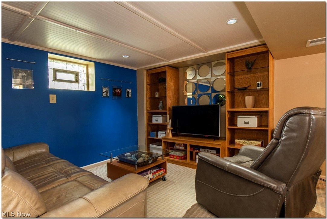 4660 Liberty Road South Euclid, OH 44121 - Photo 25 of 35 Fully Finished Lower Level Features a Spacious Media and Game Room with an Amazing Kitchenette, Perfect for Entertaining