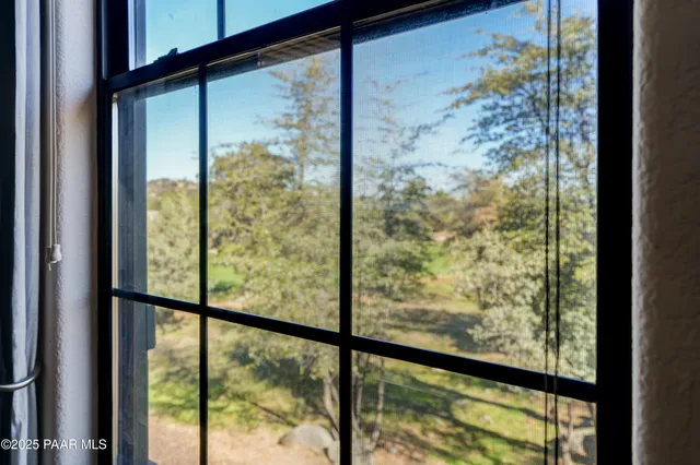 a bathroom with a granite countertop toilet sink and mirror