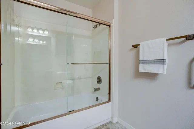 an aerial view of residential house with outdoor space and river all around