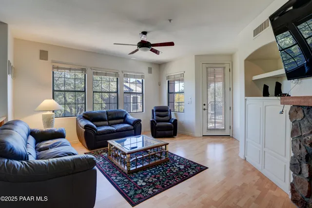 a view of a dining room with furniture and a chandelier