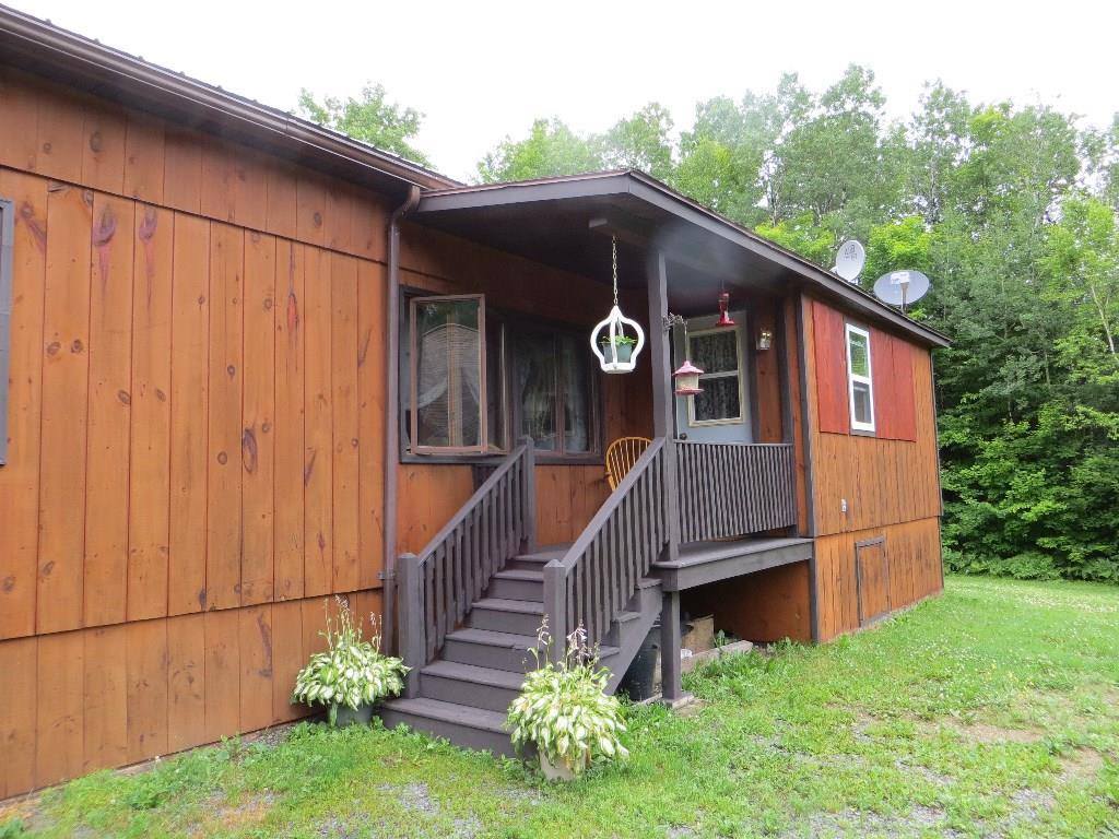 421 Beaulieu Road St. David, ME 04773 - Photo 24 of 35 Front covered porch of mobile home.