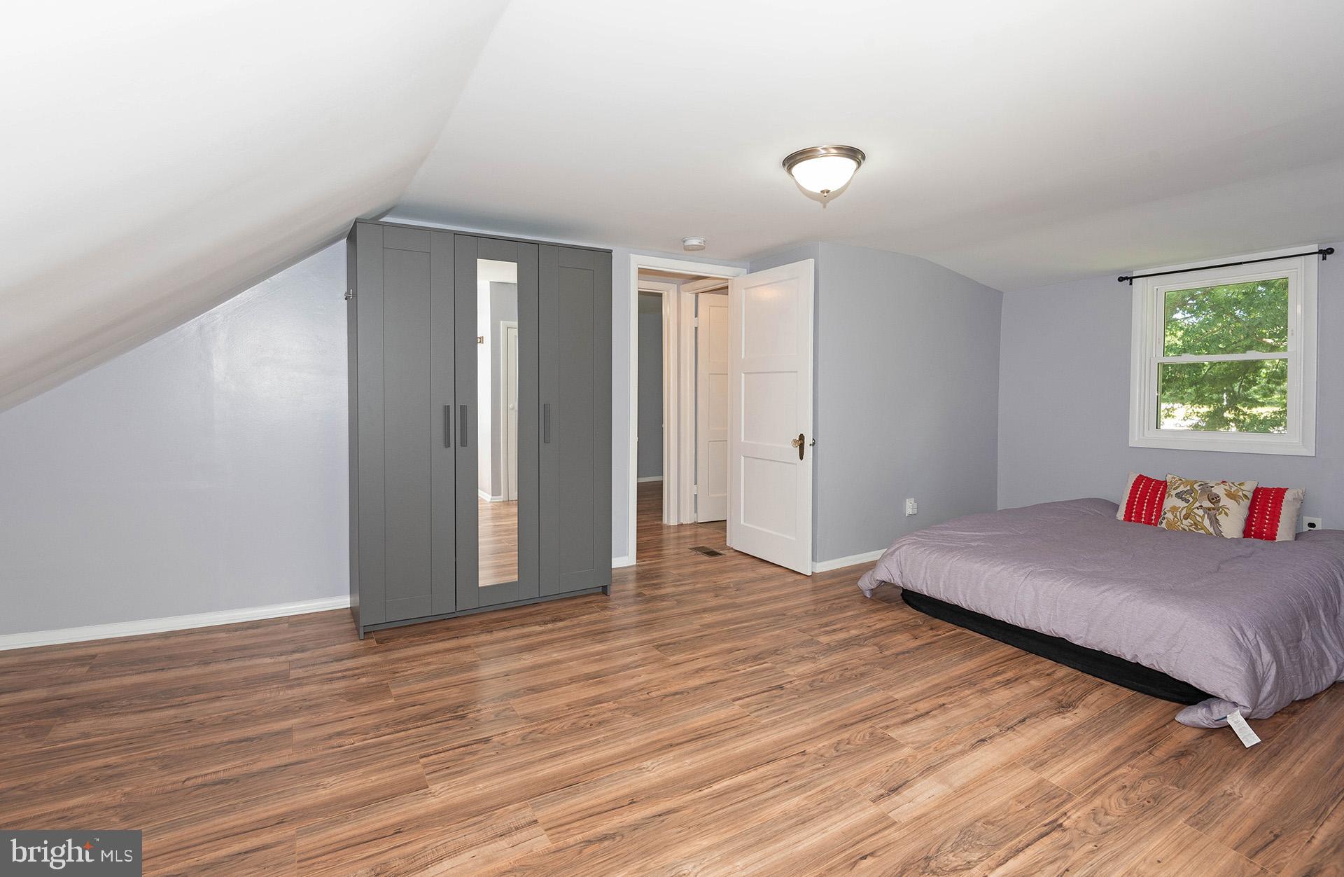 4506 Morgan Road Morningside, MD 20746 - Photo 11 of 22 a living room with a bed and a window
