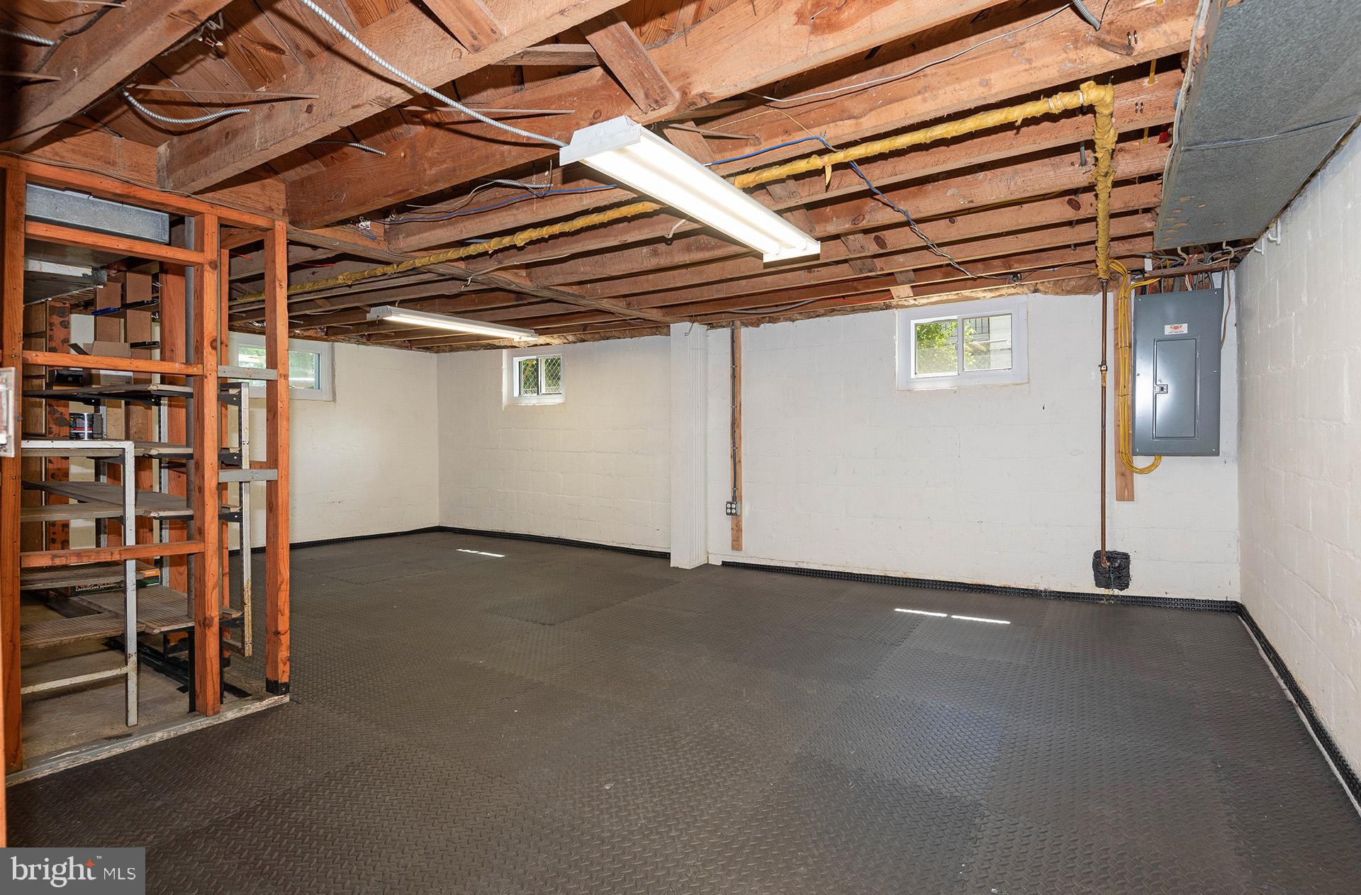 4506 Morgan Road Morningside, MD 20746 - Photo 15 of 22 a view of an empty room with wooden shelves