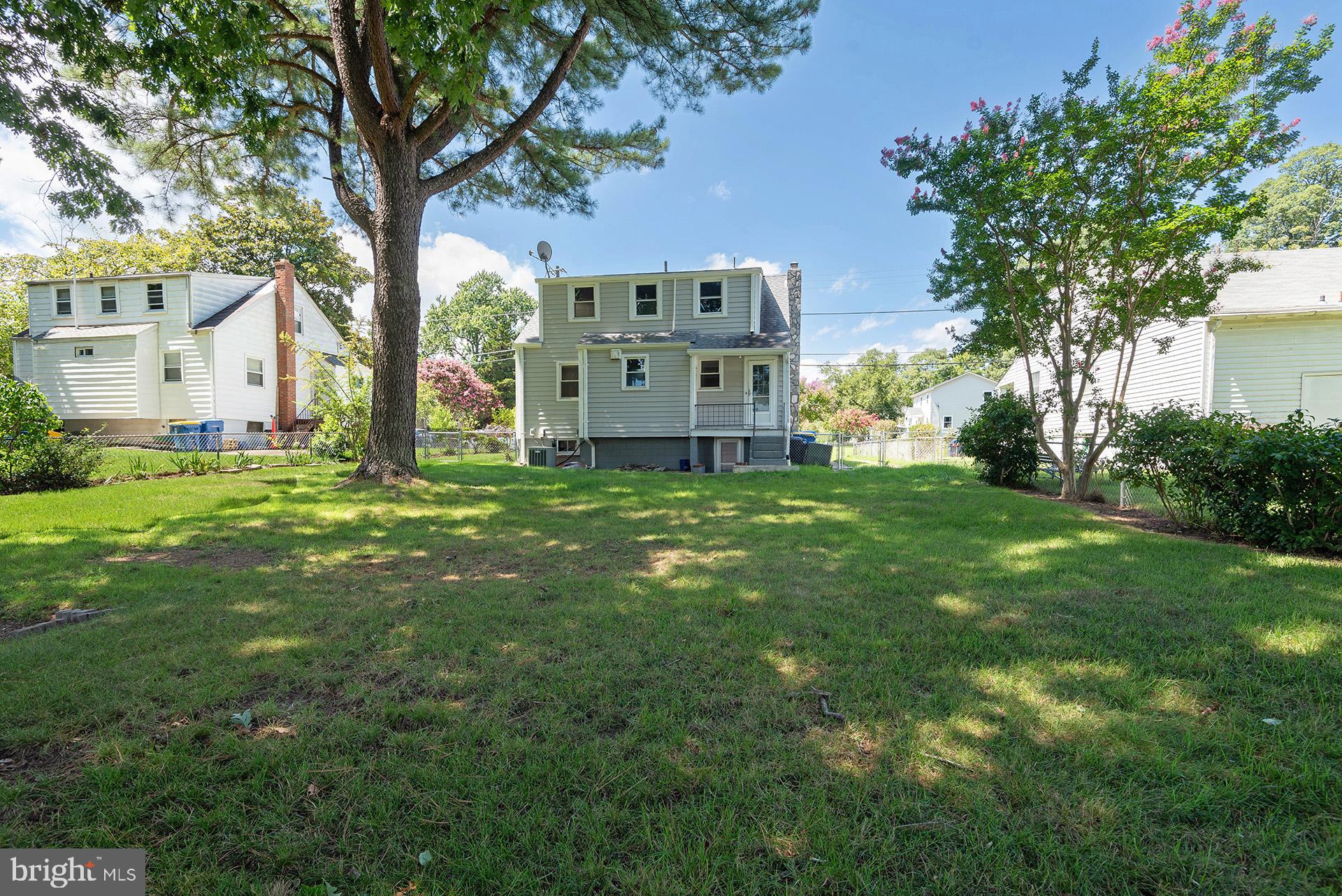4506 Morgan Road Morningside, MD 20746 - Photo 22 of 22 a view of a house with a big yard and large trees