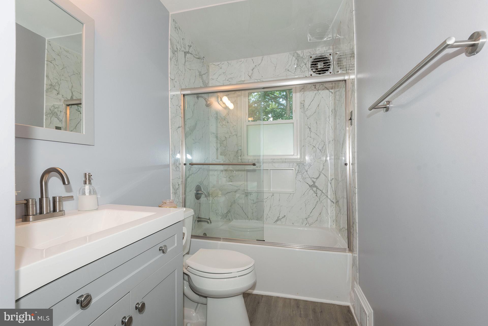 4506 Morgan Road Morningside, MD 20746 - Photo 9 of 22 a bathroom with a sink a toilet and shower