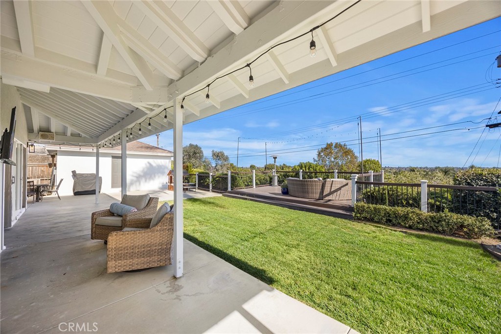 15914 West Road Whittier, CA 90603 - Photo 37 of 47 a view of a patio with a table and chairs potted plants