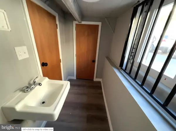 a bathroom with a sink a mirror and vanity