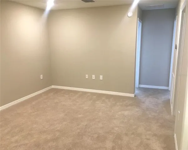 a view of a swimming pool with a yard