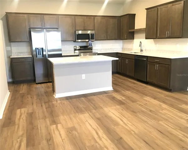 an empty room with wooden floor