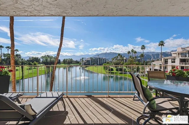 a view of a balcony with chairs