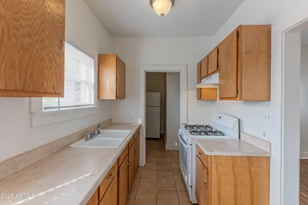 a bathroom with a sink a vanity and a mirror