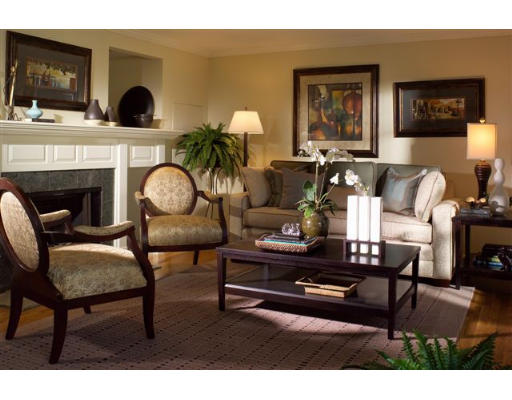 113 Jericho Road, Unit 113 Weston, MA 02493 - Photo 1 of 1 a living room with furniture and a fireplace