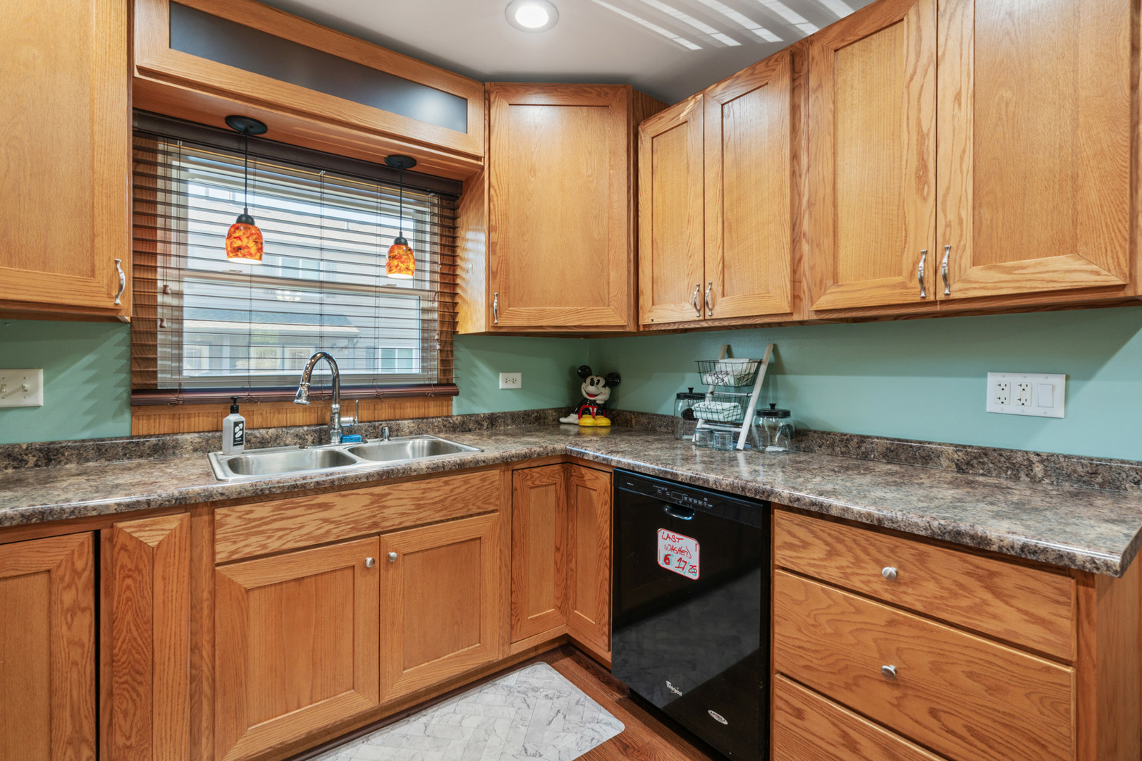 206 Washington Street Oswego, IL 60543 - Photo 14 of 45 a kitchen with stainless steel appliances granite countertop a sink and cabinets