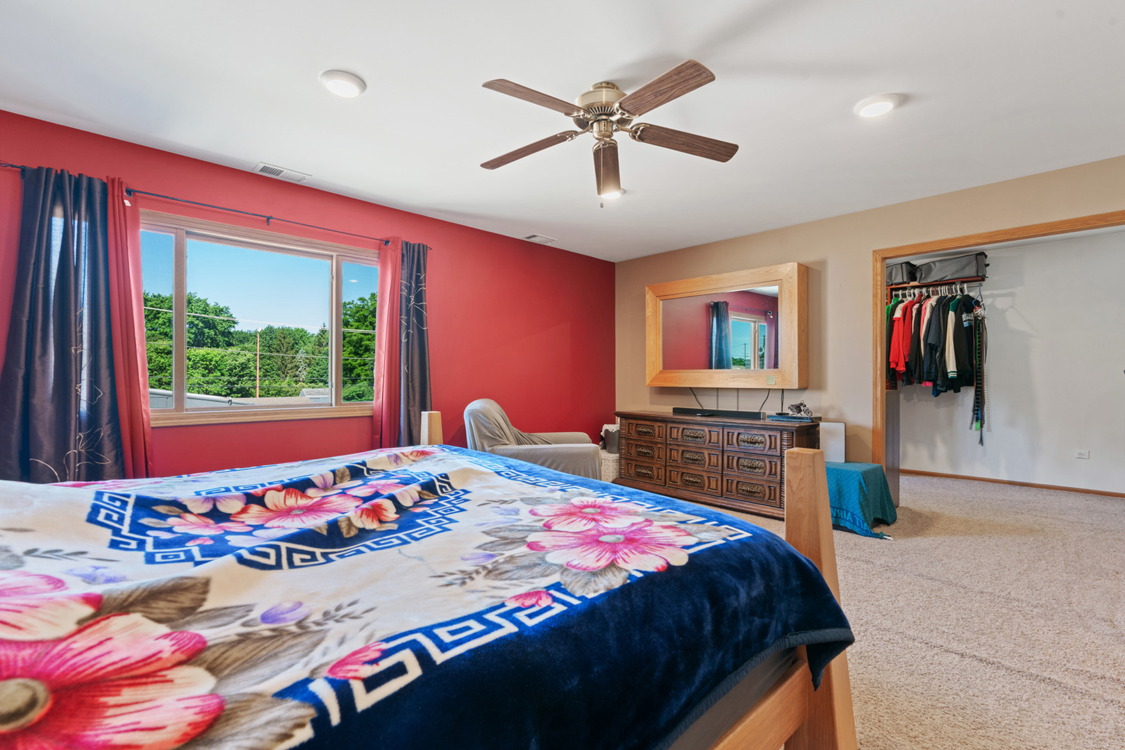 206 Washington Street Oswego, IL 60543 - Photo 31 of 45 a bedroom with a bed and a chandelier