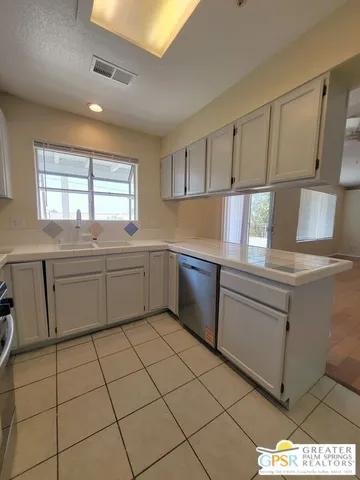 a view of an empty room with a closet