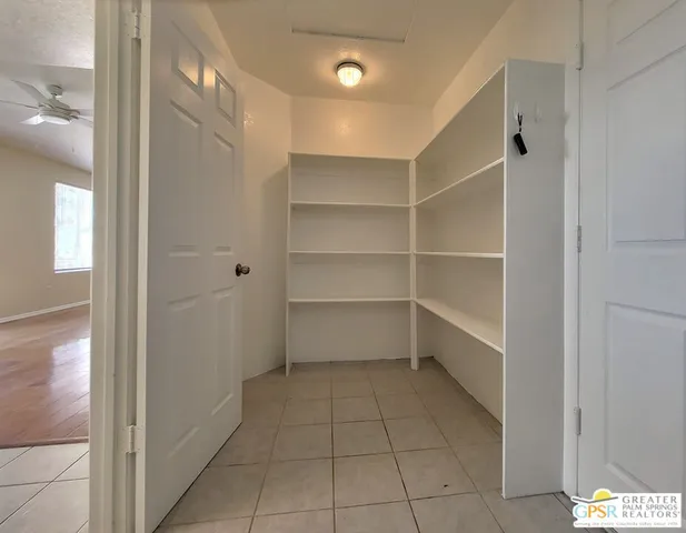 a view of an empty room with a fireplace