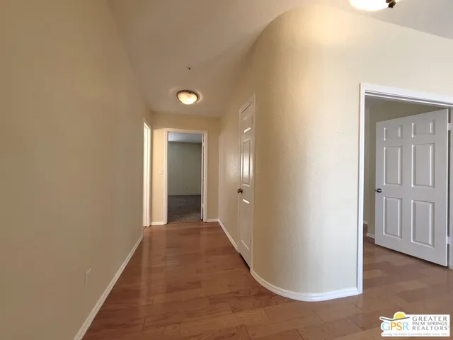 a view of a livingroom with a ceiling fan and window