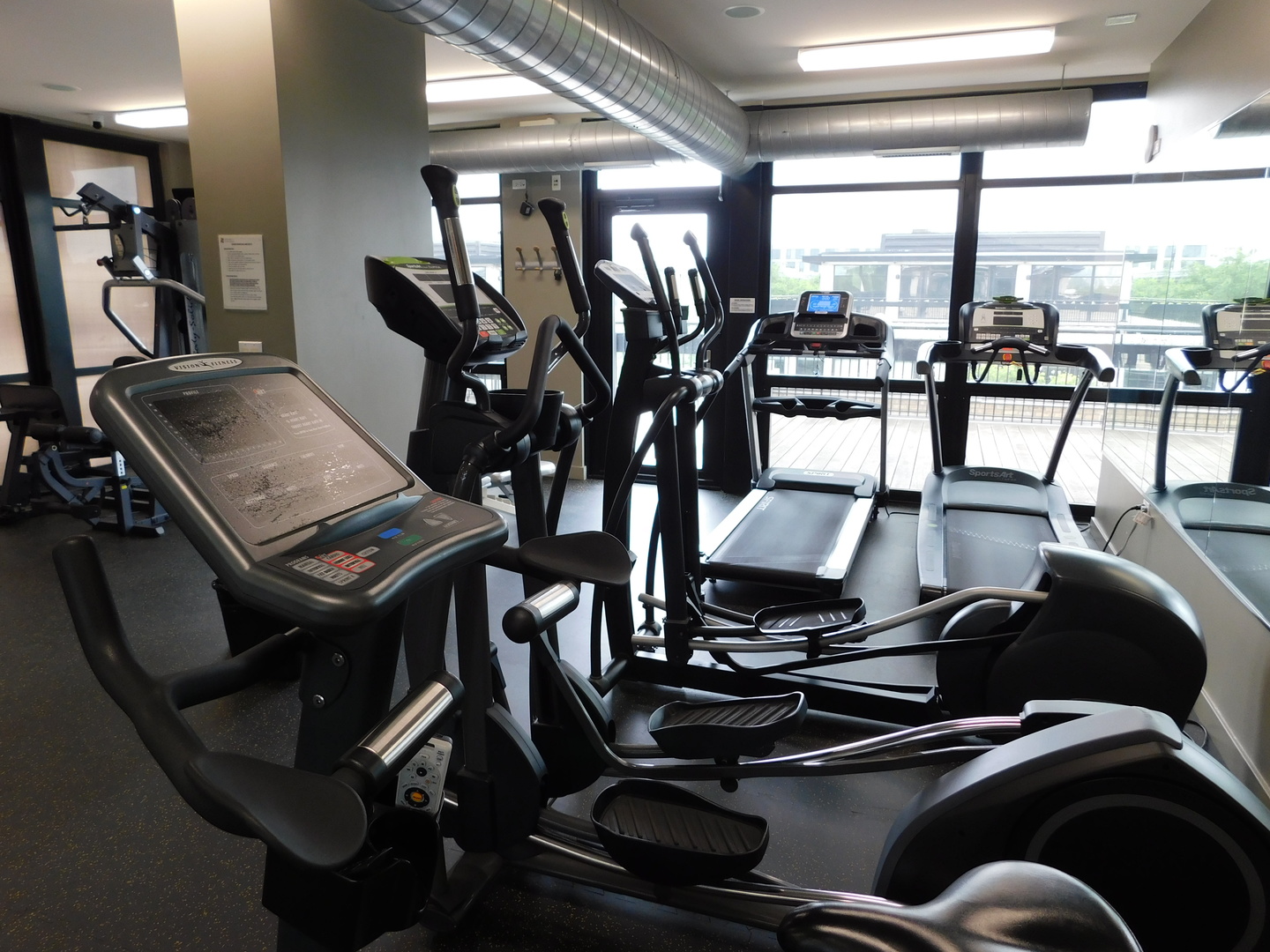 1069 West 14th Place, Unit 204 Chicago, IL 60608 - Photo 11 of 18 a view of a room with gym equipment