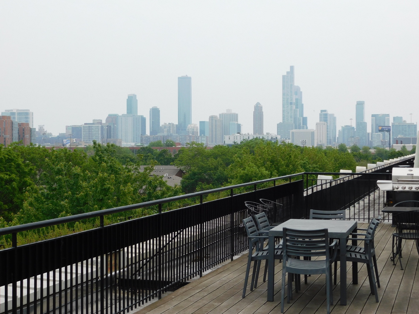 1069 West 14th Place, Unit 204 Chicago, IL 60608 - Photo 15 of 18 a view of a city from a roof with sitting area