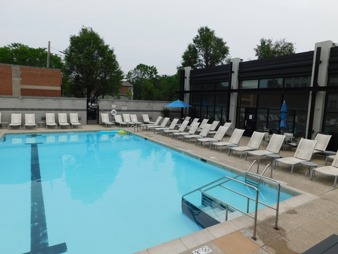 1069 West 14th Place, Unit 204 Chicago, IL 60608 - Photo 10 of 18 a view of swimming pool with outdoor seating and plants