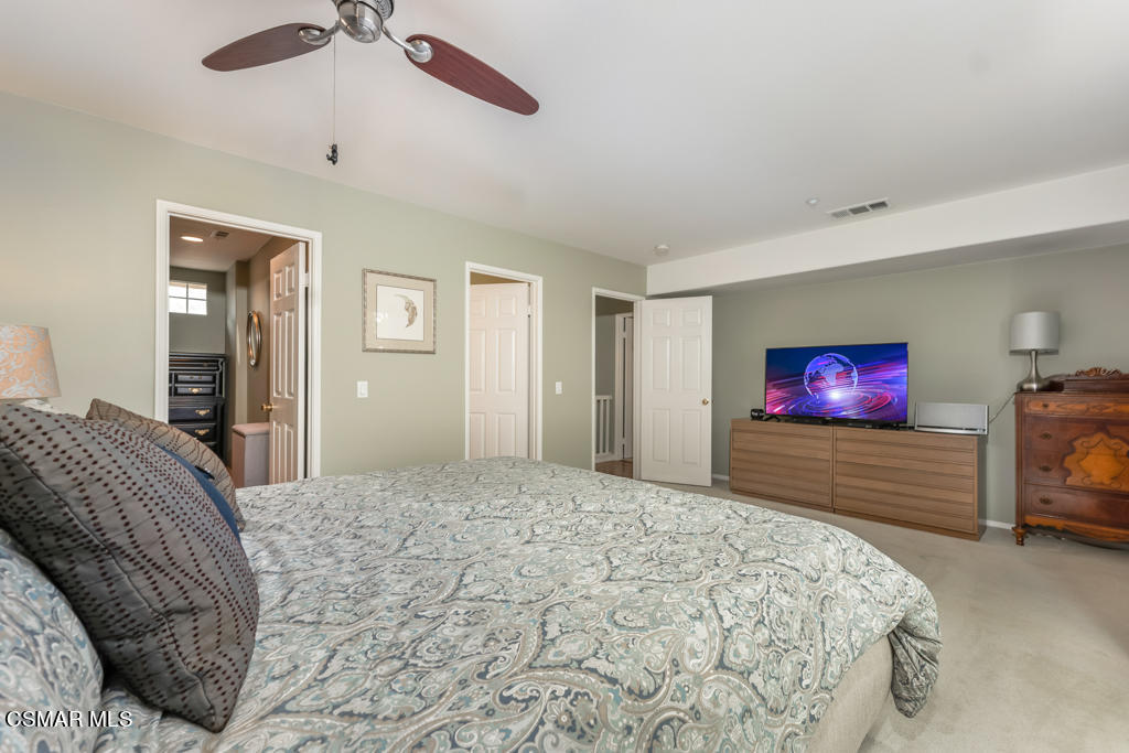 2307 Shakespeare Drive Oxnard, CA 93033 - Photo 22 of 42 a bedroom with a large bed and a flat screen tv