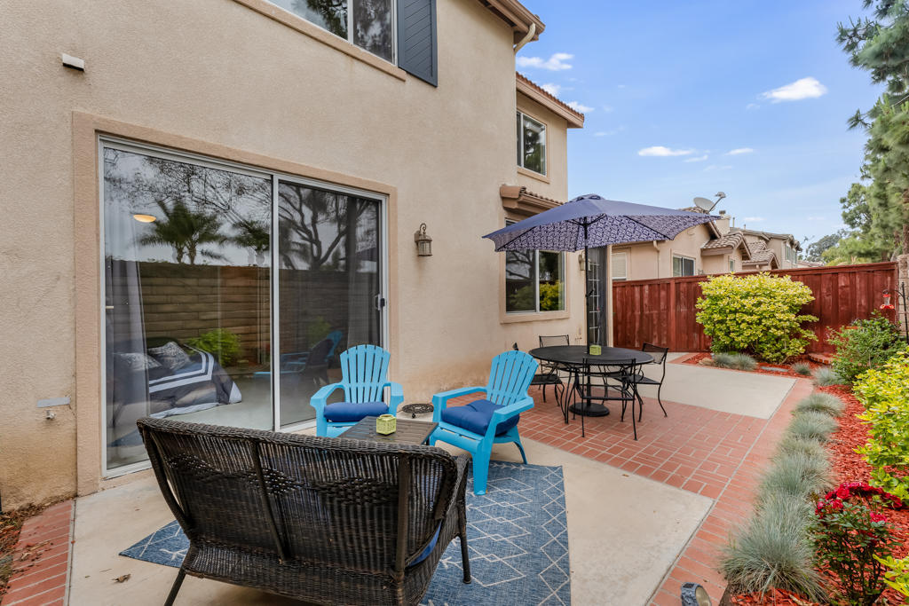 2307 Shakespeare Drive Oxnard, CA 93033 - Photo 33 of 42 a view of a patio with couches table and chairs and potted plants