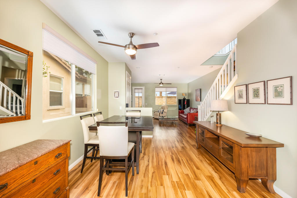 2307 Shakespeare Drive Oxnard, CA 93033 - Photo 10 of 42 a view of a dining room with furniture a chandelier and wooden floor