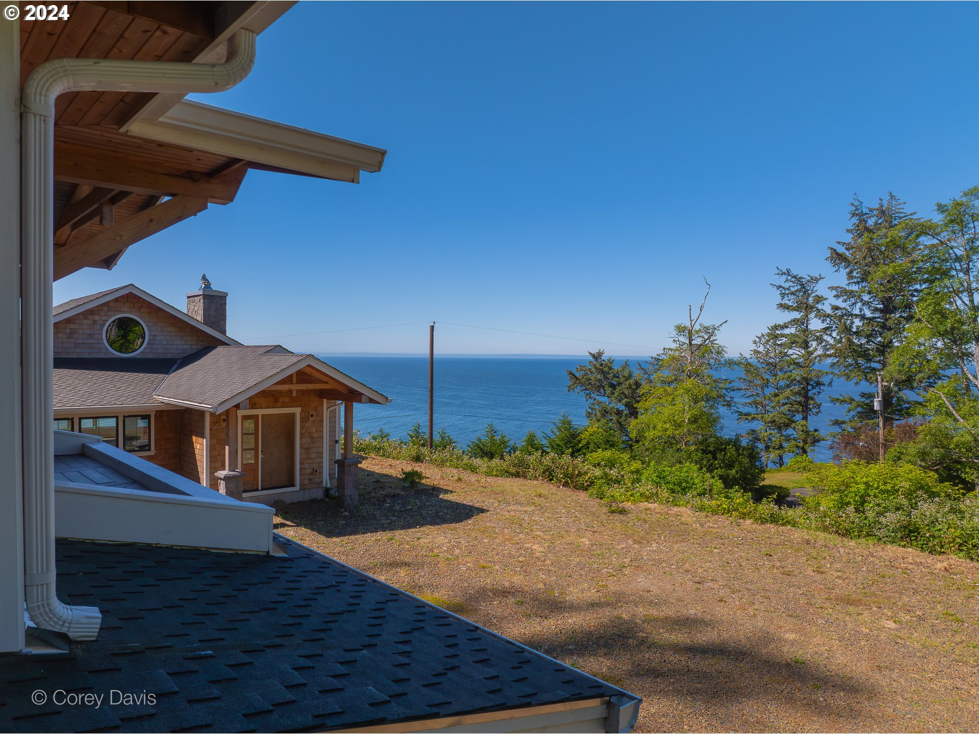 38625 Beulah Reed Road Nehalem, OR 97131 - Photo 20 of 38 a front view of a house with a yard and balcony