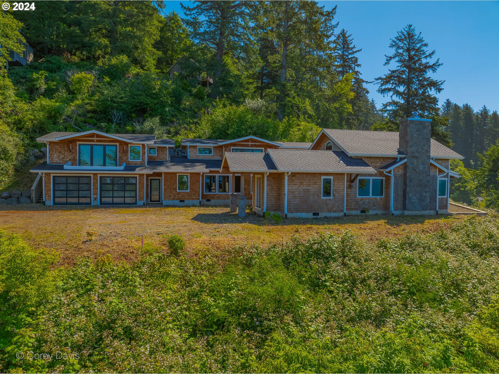 38625 Beulah Reed Road Nehalem, OR 97131 - Photo 3 of 38 a front view of a house with a garden