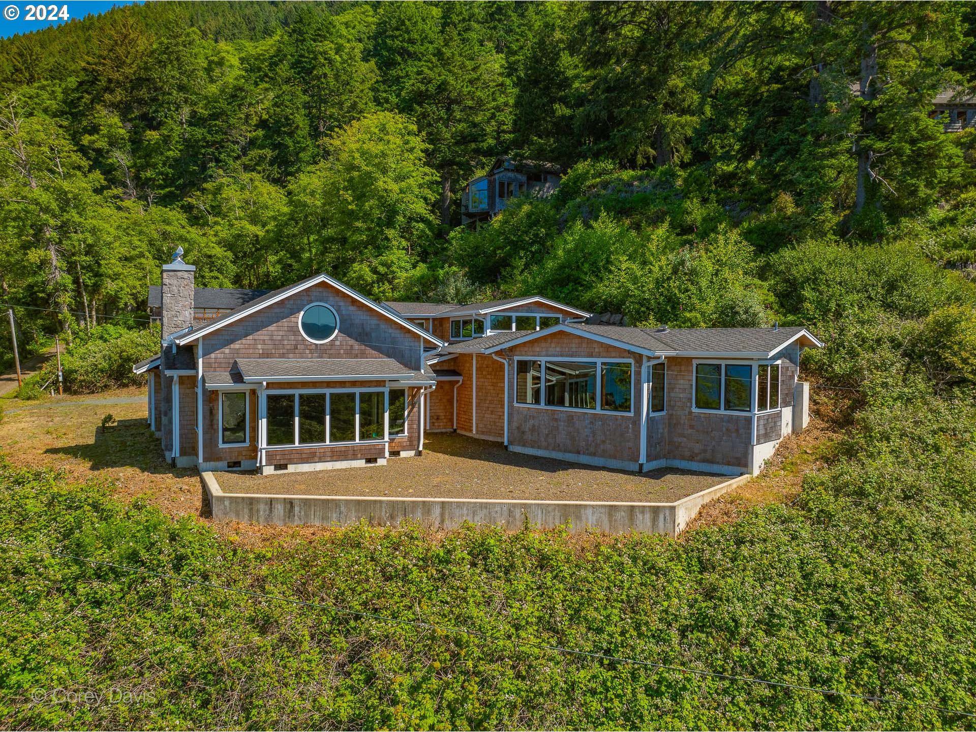 38625 Beulah Reed Road Nehalem, OR 97131 - Photo 5 of 38 a front view of a house with a garden