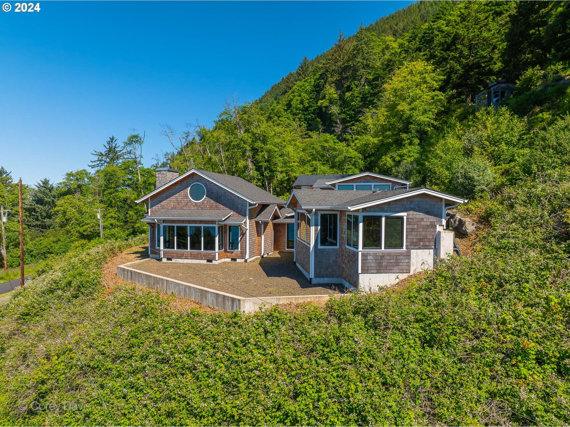 38625 Beulah Reed Road Nehalem, OR 97131 - Photo 6 of 38 a front view of a house with a garden