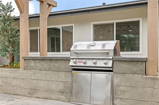 a living room with furniture a rug and white walls