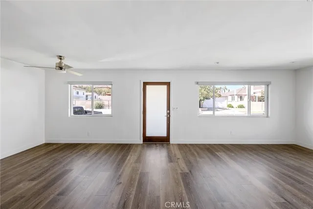 a view of a kitchen with wooden floor