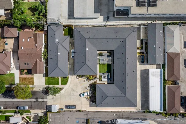 a view of a house with a yard and tree s