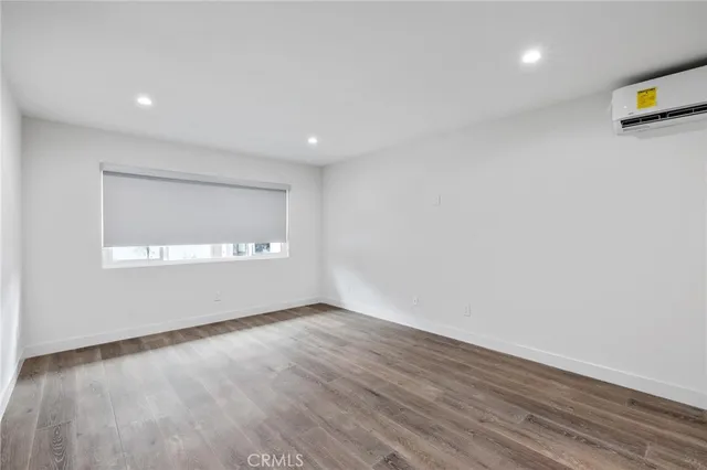 a view of a kitchen with wooden floor