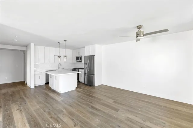 a kitchen with a refrigerator and washer